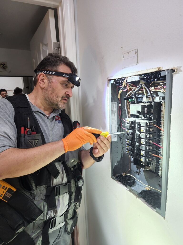 Licensed DNZ electrician replacing an outdated electrical panel with a new 200-amp panel in a residential home in Los Angeles County