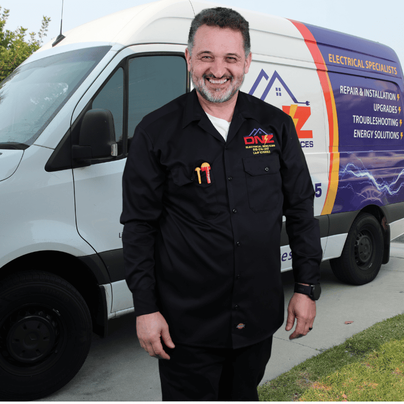 DNZ Electrical Services Electrician – Agoura Hills Electrical Contractor DNZ Electrical Services licensed electrician standing in front of company service van in Agoura Hills California providing electrical repair and installation services.